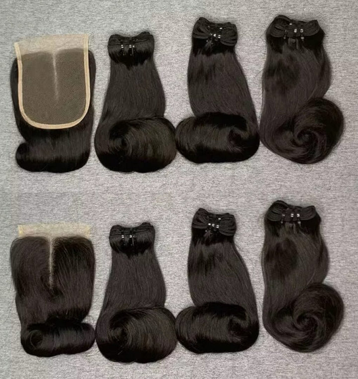 Black curled hair bundles and lace closure shown from the hair and lace sides