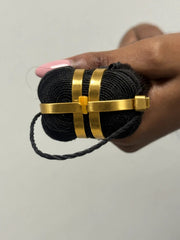 Close-up of RAW Vietnamese straight hair wefts secured with gold packaging rings