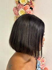 Brazilian 10-inch black straight 4×4 lace bob wig, side view on model