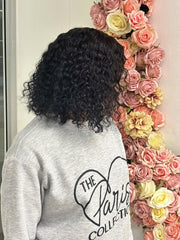 Brazilian black water-wave 4×4 lace wig, three-quarter view on model