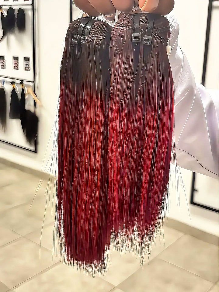 Burgundy straight hair bundles with dark roots held up in store